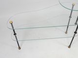 an image of a glass coffee table with brass legs and a glass top
