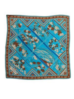 a blue and brown scarf with flowers and leaves on it