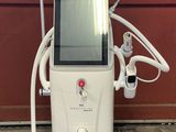 an image of a machine that is sitting in front of a red wall