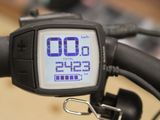 a close up of a bicycle with a digital clock on it