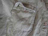 a close up of a shirt with buttons on it