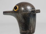 an image of a metal object with a bird ' s head on it ' s head