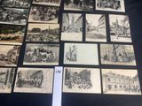 a lot of old black and white pictures on the table