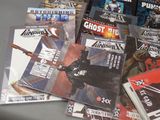 a lot of comic books sitting on a table