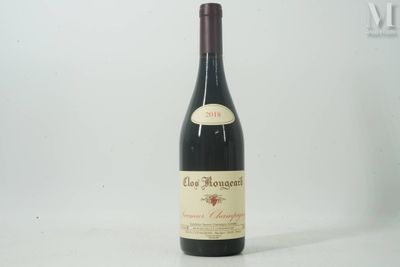 a bottle of wine that is sitting on a table