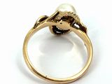 an image of a gold ring with a pearl and a diamond