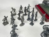 a lot of figurines that are sitting on a table