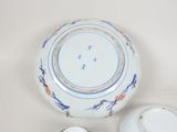 a white plate with a blue and gold design on it