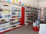 many shelves of toys in the store with toys on them