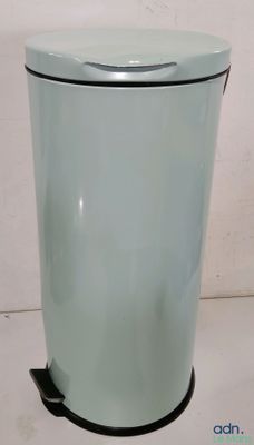 a blue trash can sitting on a white surface
