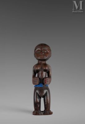 a wooden figure of a man with a bowl in his hands