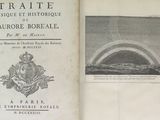 un vieux livre avec une image d'un arc-en-ciel dans le ciel