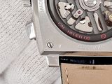 a close up of a wrist watch with a leather band