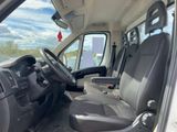 the interior of a white van with black seats and a steering wheel