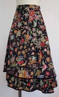 a black skirt with a floral pattern on it