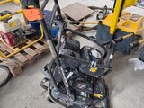 a small machine that is sitting in the garage