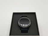 a close up of a smart watch in a box on a table
