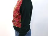 a picture of a woman wearing a sweater and jeans