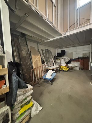 an image of a room with a lot of stuff on the floor
