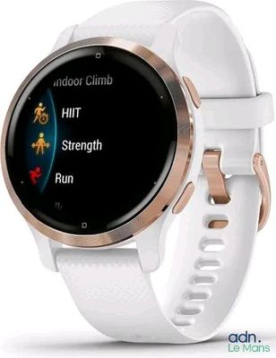 a close up of a smart watch on a white surface