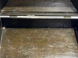 a black oven with a door open on the inside of it