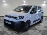 the white van is parked on a checkered floor in a room