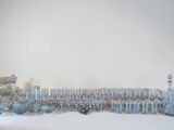 a lot of glass vases sitting on a white table