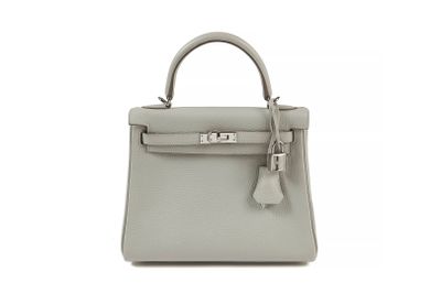 a small grey leather handbag on a white background
