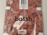a bag of meat on a table with a price tag