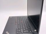 a laptop that is sitting on a white surface