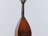 a close up of a mandolin hanging from a string