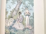 an open book with a picture of a man and a woman sitting under a tree
