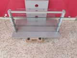 a glass shelf with two shelves on top of it