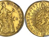 a gold coin with the image of the virgin and child on it
