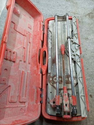 a tool box with tools inside of it on the floor