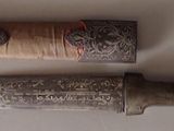 two knives that are sitting on a table