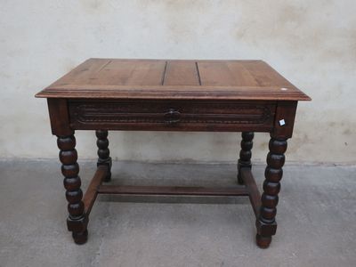 a wooden table with a drawer underneath it
