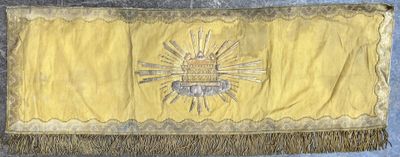 an image of a yellow and black flag with a sun on it