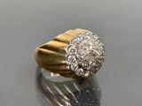 a close up of a diamond ring on a table