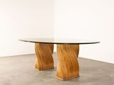 an image of a table with a glass top and wooden legs
