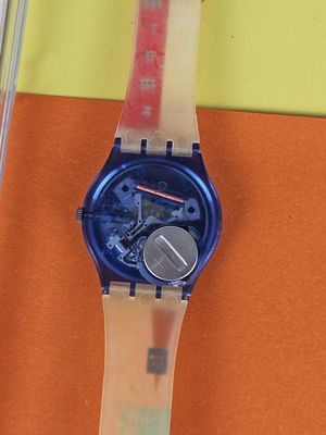 a watch that is sitting on top of a piece of paper