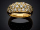 an 18k gold and diamond band ring
