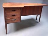 an image of a desk with three drawers and a drawer underneath it