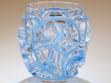 a clear glass vase with a blue design on it