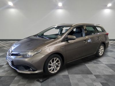 the toyota sienna is parked on a checkered floor in a garage