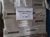 a large stack of newspapers sitting on a shelf in a warehouse