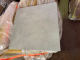 a pile of concrete blocks sitting on top of a pile of plastic