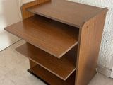 an image of a wooden shelf with three shelves on it
