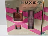 two boxes of nuxe rose a l ' infinil perfumes on a white surface