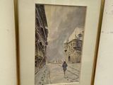 framed picture of a person walking down a street in a city